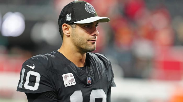 Raiders quarterback Jimmy Garoppolo looks on before a game.